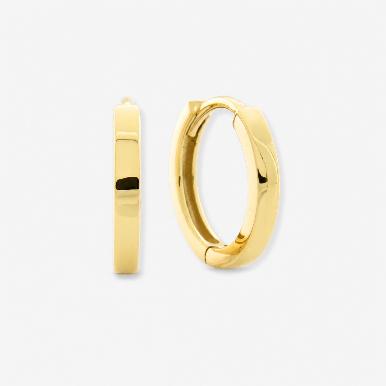 Gold hoop earrings on a white background