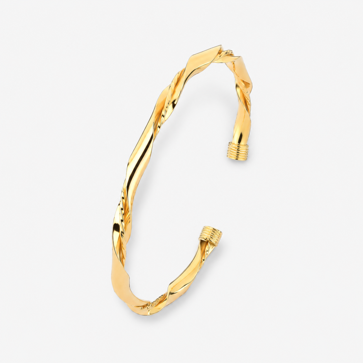 Gold bracelet on a light gray background