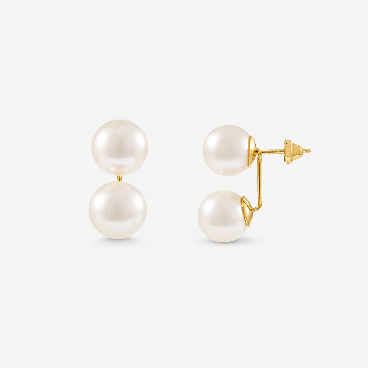 Pearl earrings with gold posts on a white background