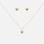 Gold heart necklace and earrings on a white background