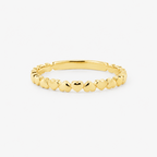 Gold ring with hearts on a white background
