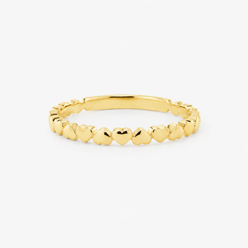 Gold ring with hearts on a white background