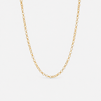 Gold chain necklace on a light gray background