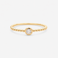 Gold ring with a diamond on a white background