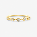 Gold ring with small diamonds on a white background