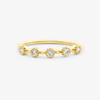 Gold ring with small diamonds on a white background