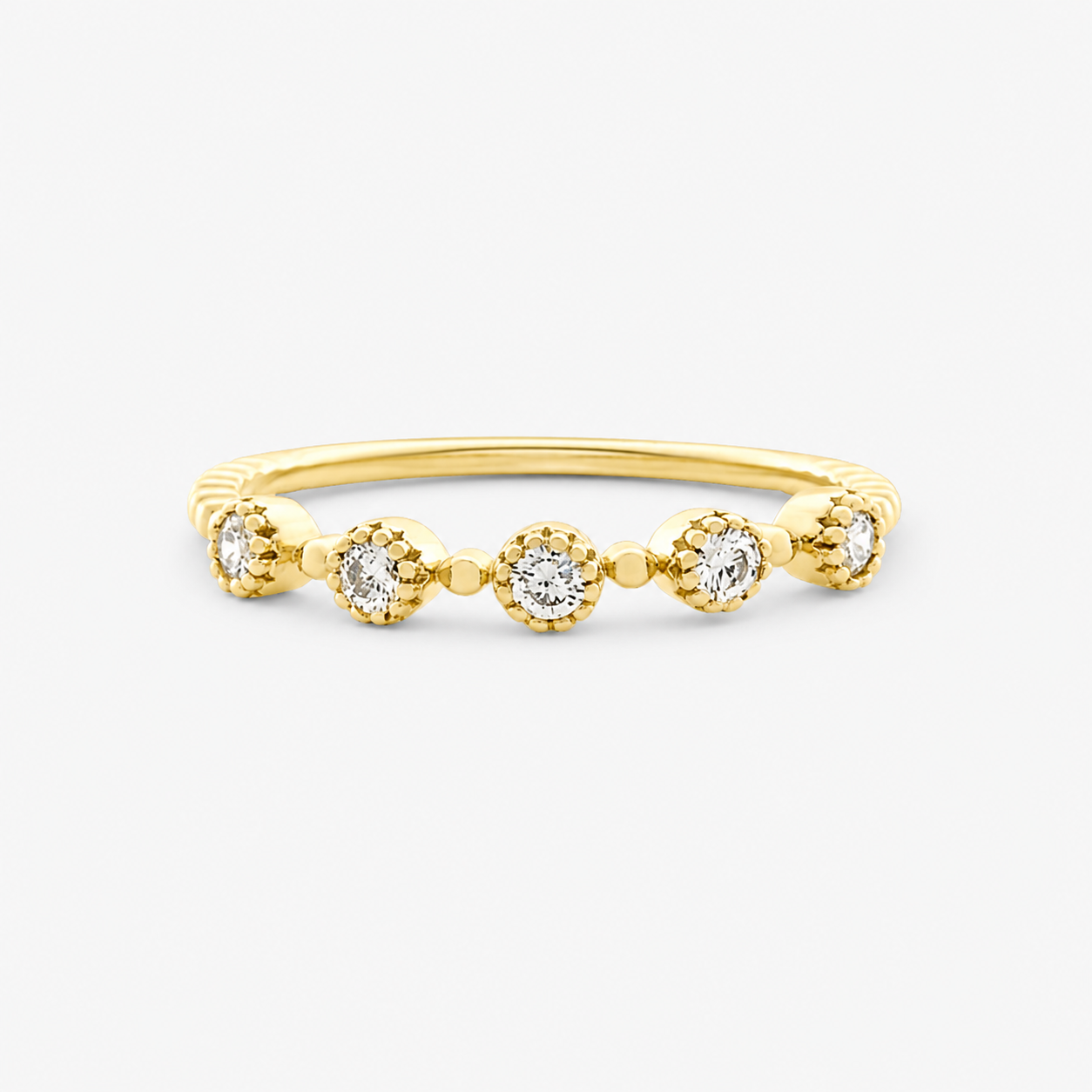 Gold ring with small diamonds on a white background