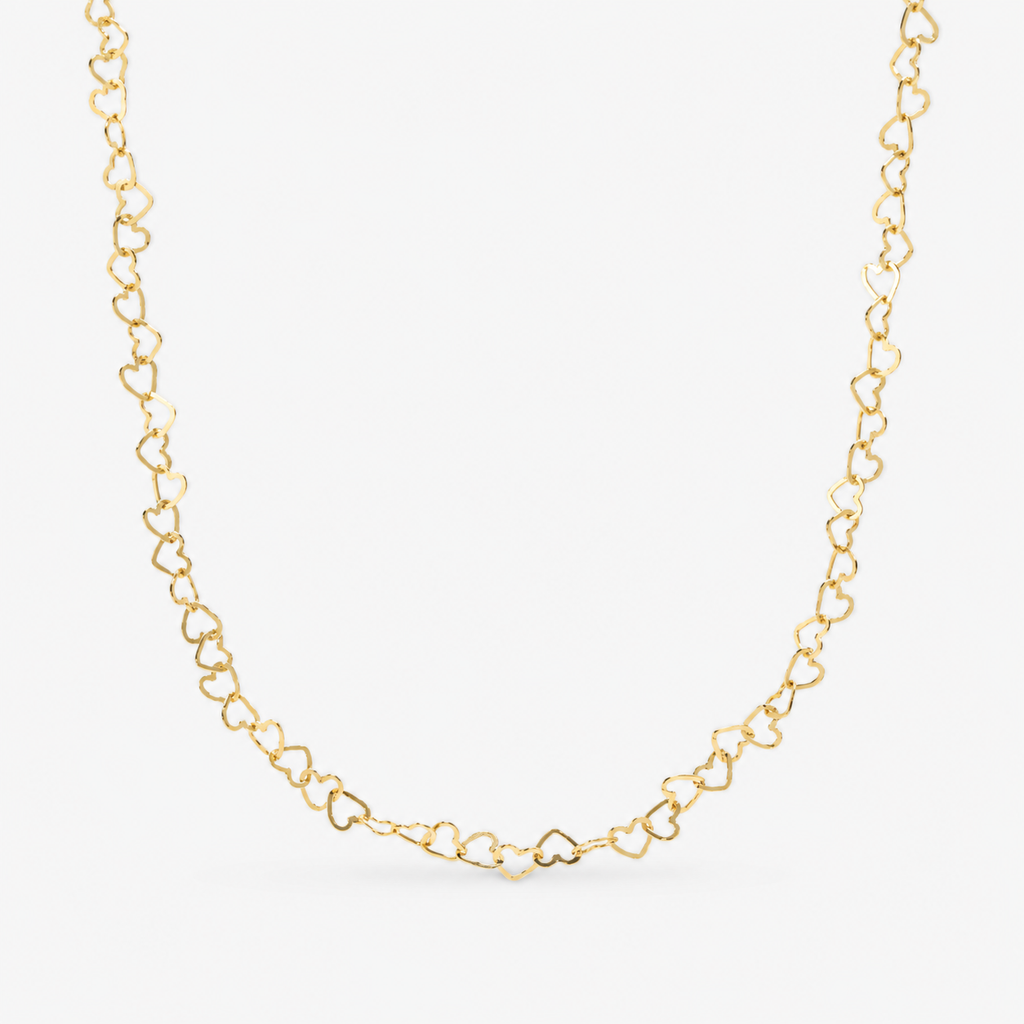 Gold heart-shaped chain necklace on a white background