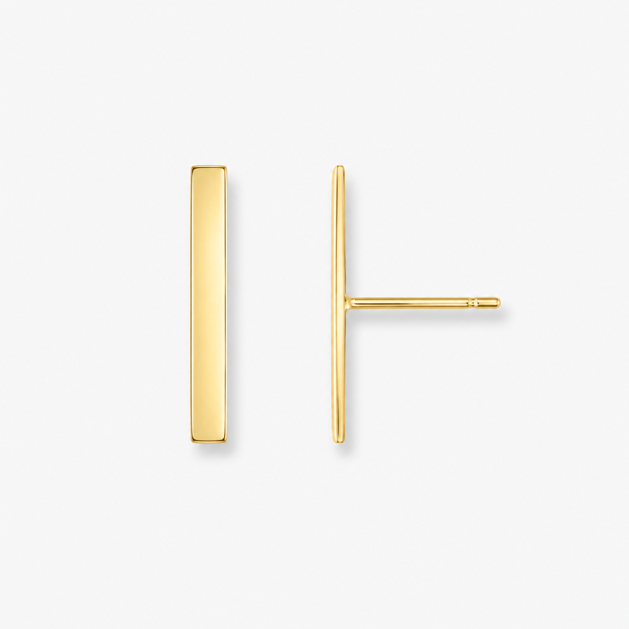 Gold bar earrings on a white background