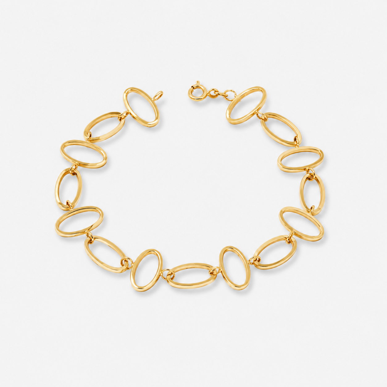 Gold chain bracelet on a light gray background