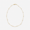 Gold necklace with pearls on a white background