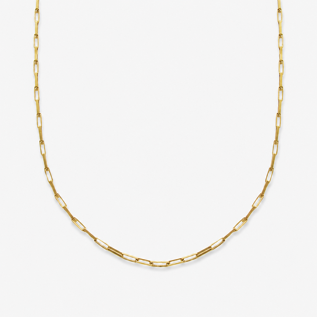 Gold chain necklace on a white background
